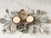 Load image into Gallery viewer, Antique zinc tealight holder with ornate leaves.
